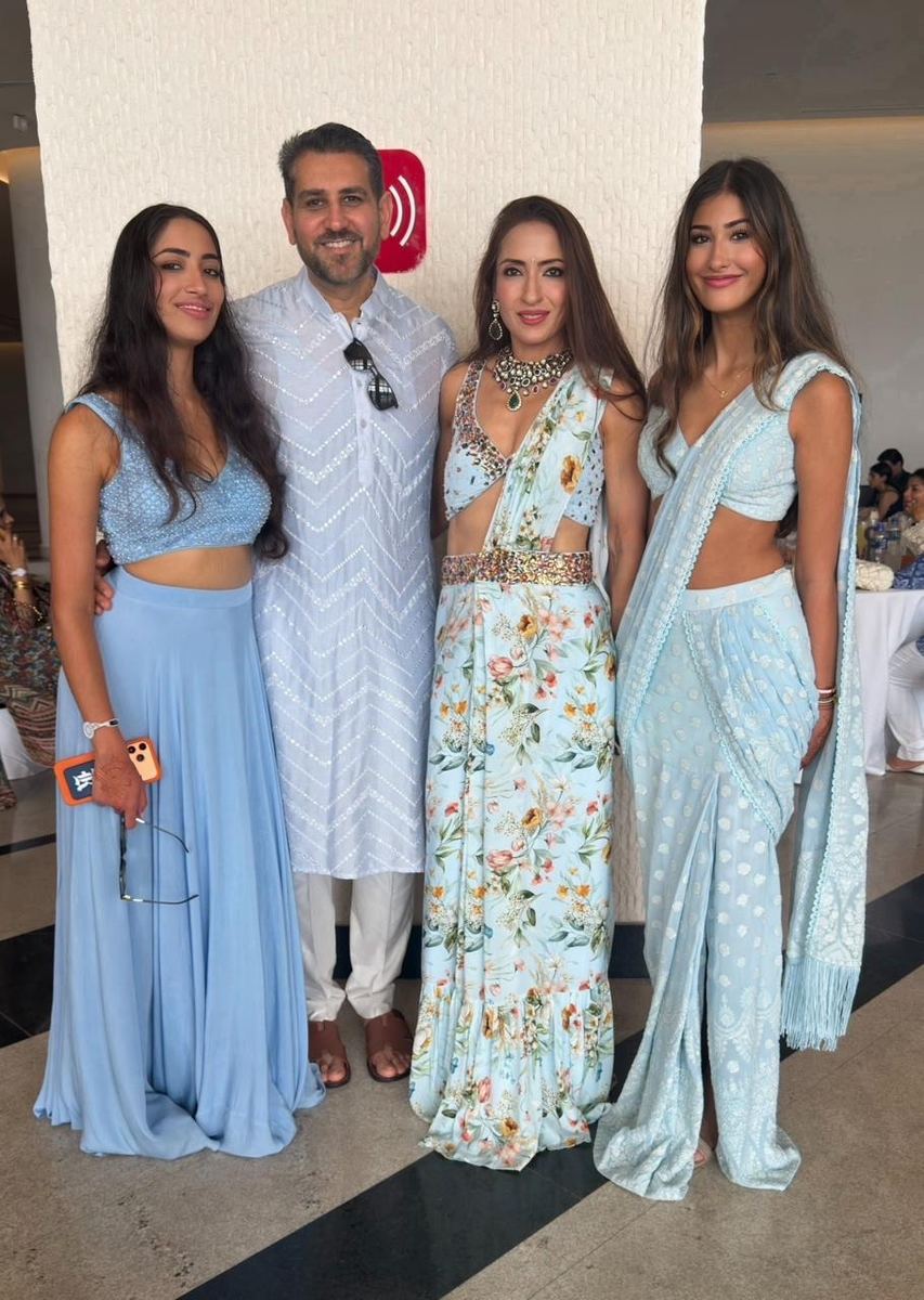 Family styled in coordinated pastel blue outfits